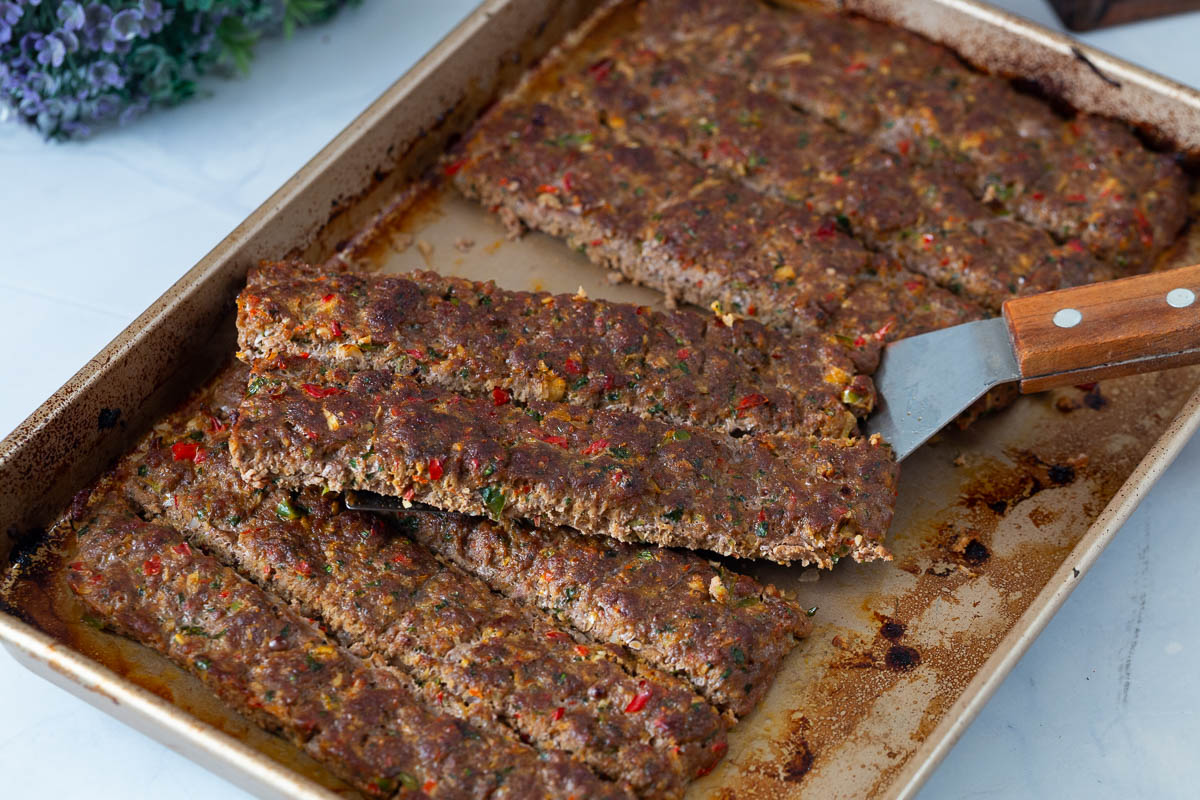 Baked sheet pan kebabs on the table.