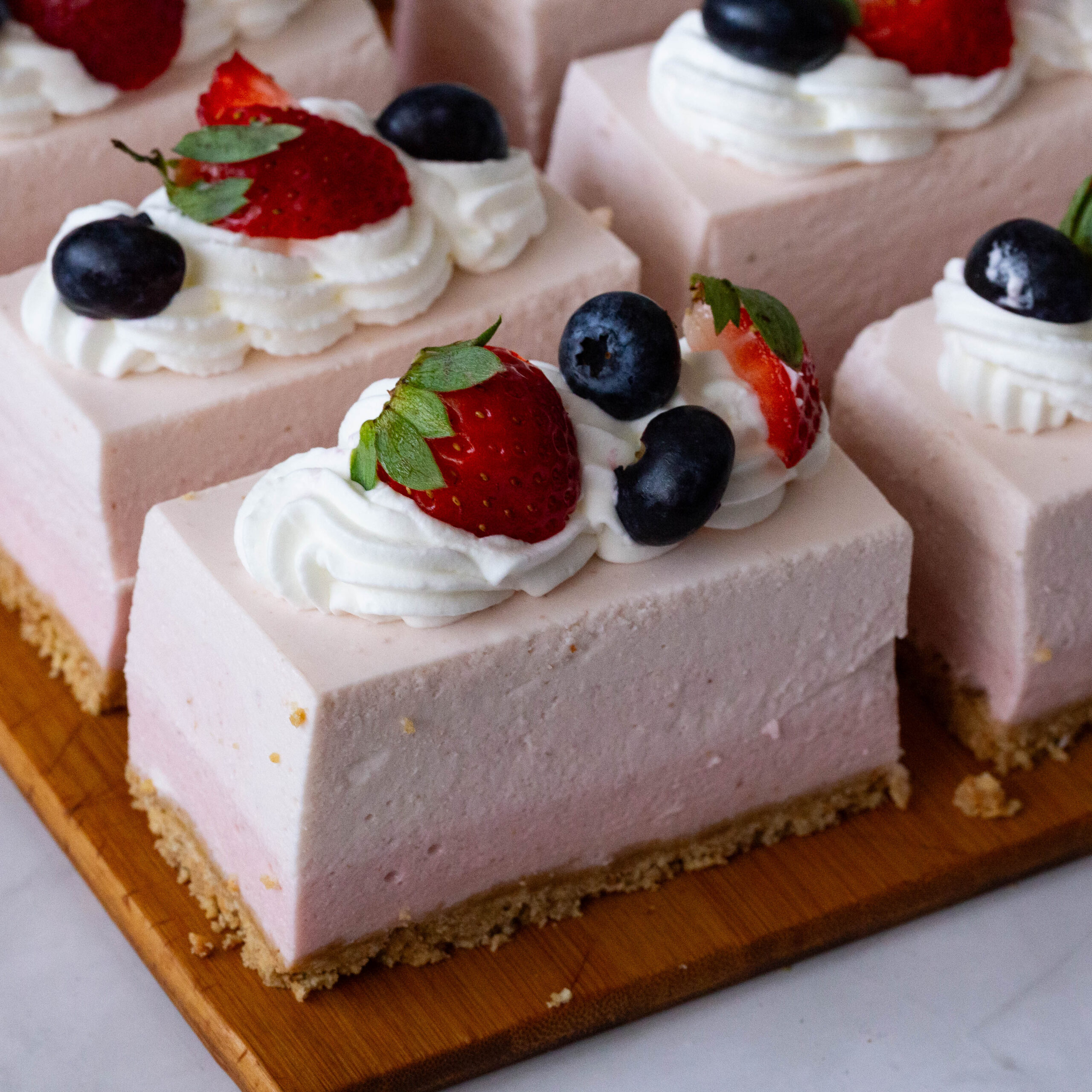 A slice of Ombre No Bake Strawberry Mousse.