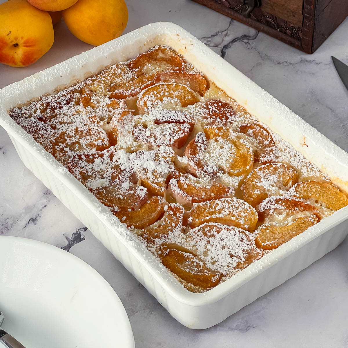 A baking dish with apricot clafoutis.