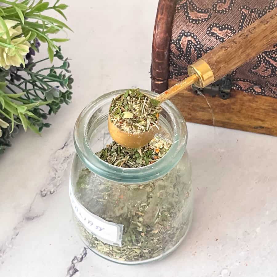 A jar with spice mix Italian seasoning.