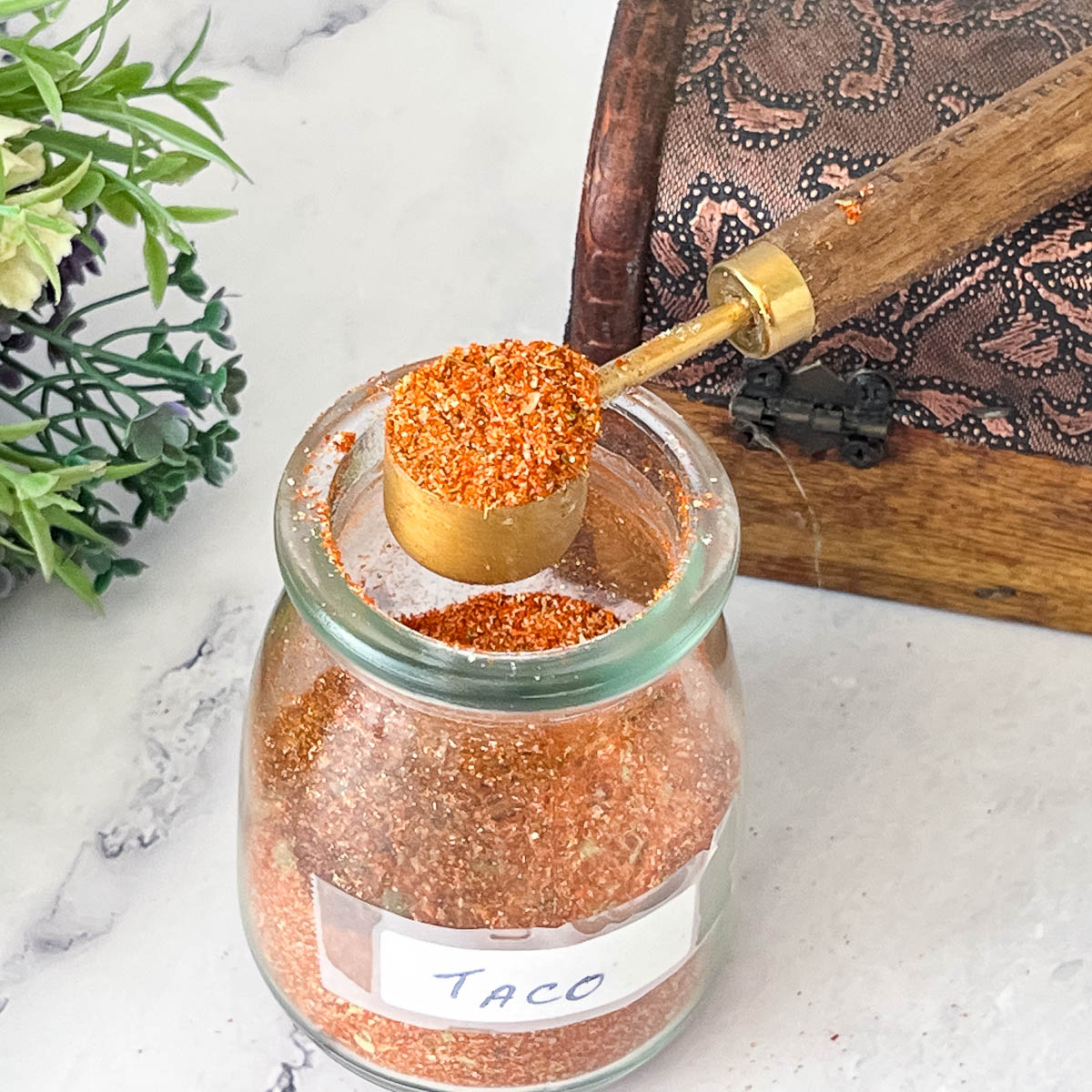 Taco seasoning in a spice jar.