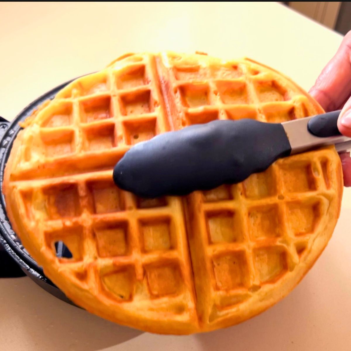 Waffles iron with crispy waffle.