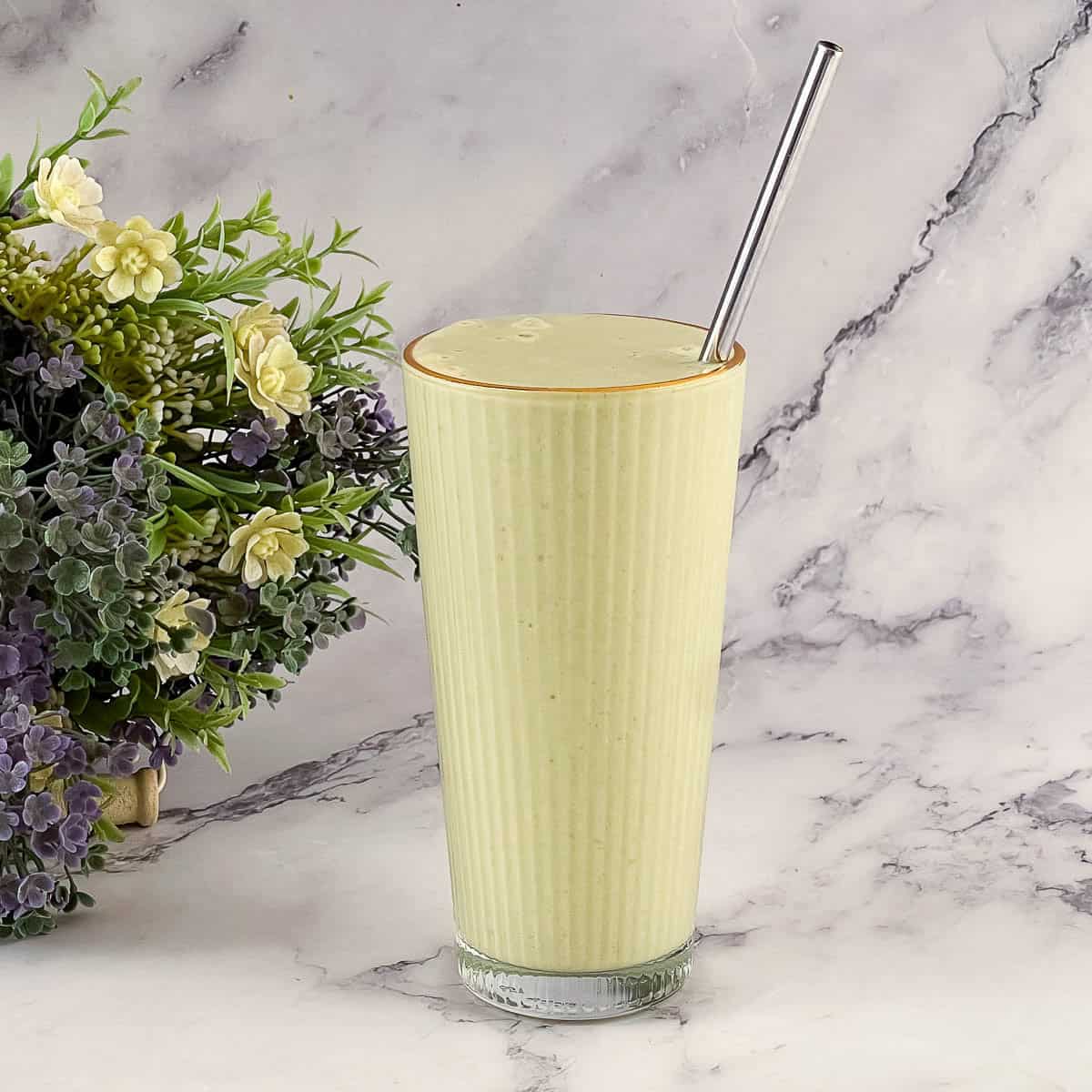 Matcha smothie in a tall glass.