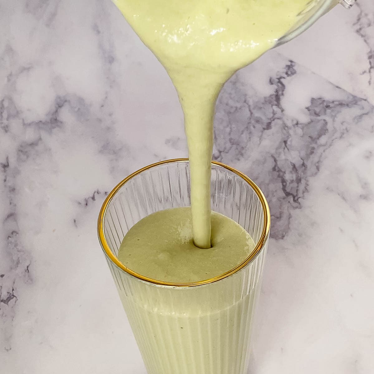 Pouring matcha into the glass.