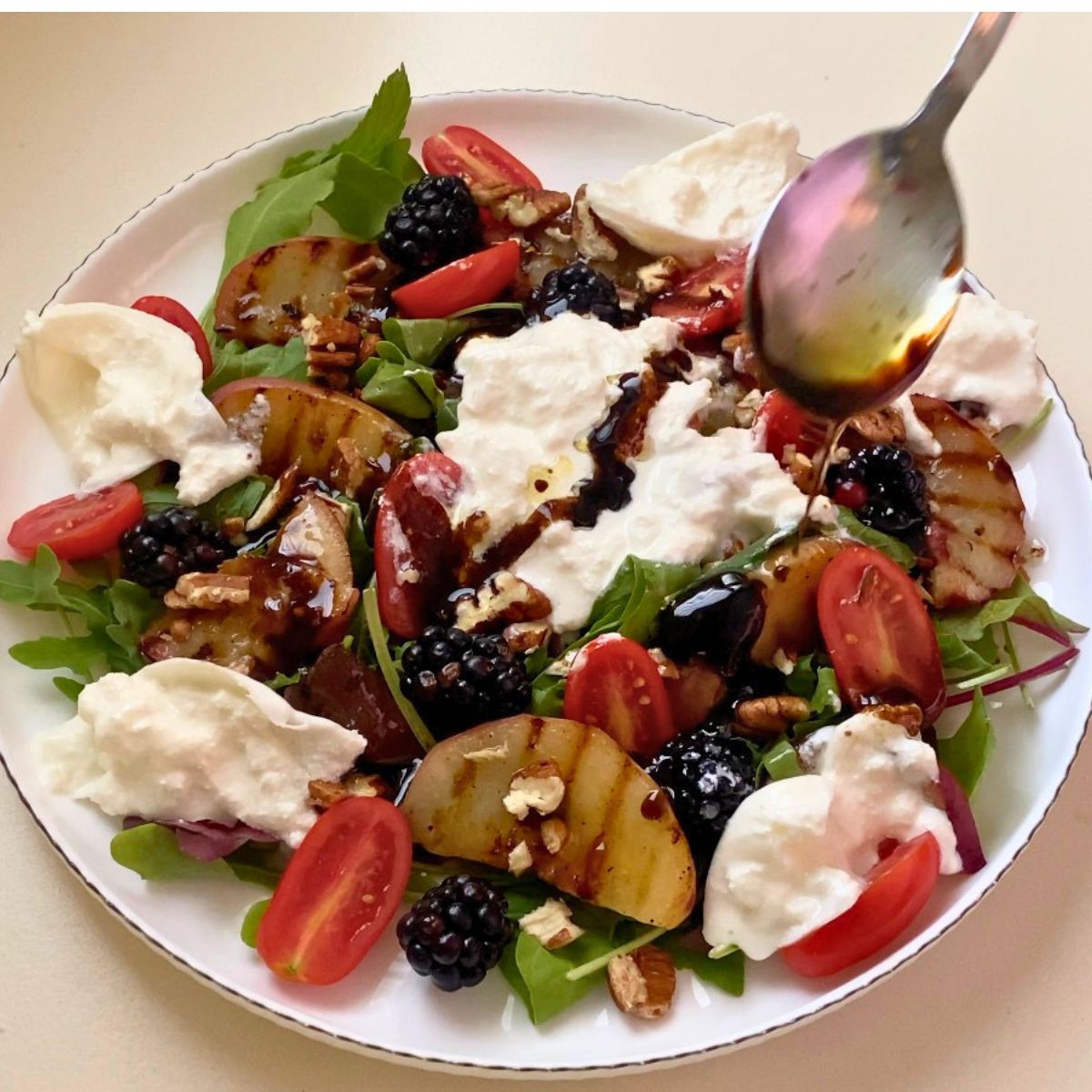 Spoon the dressing over the peach salad.