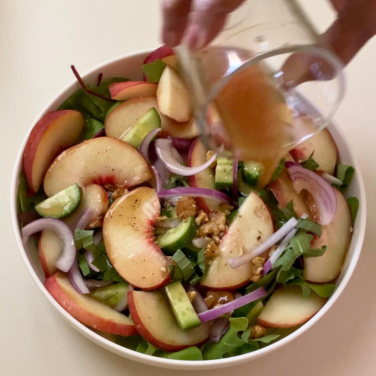 A plate with fresh pleach salad.