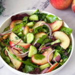 A peach salad onthe table.