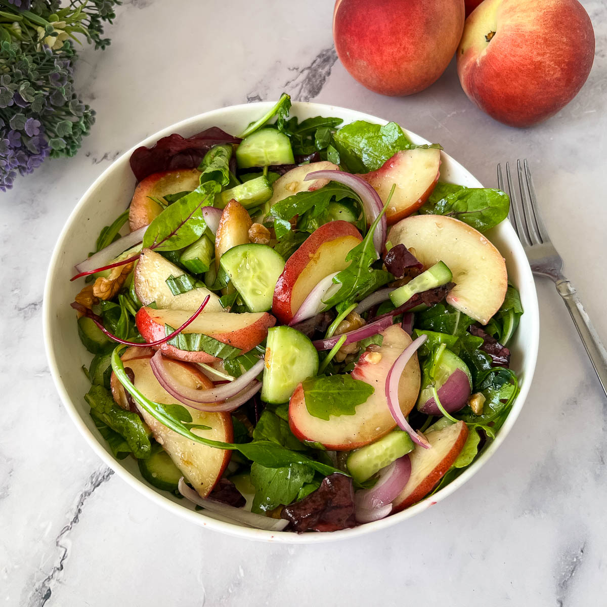 A salad plate with peach salad.