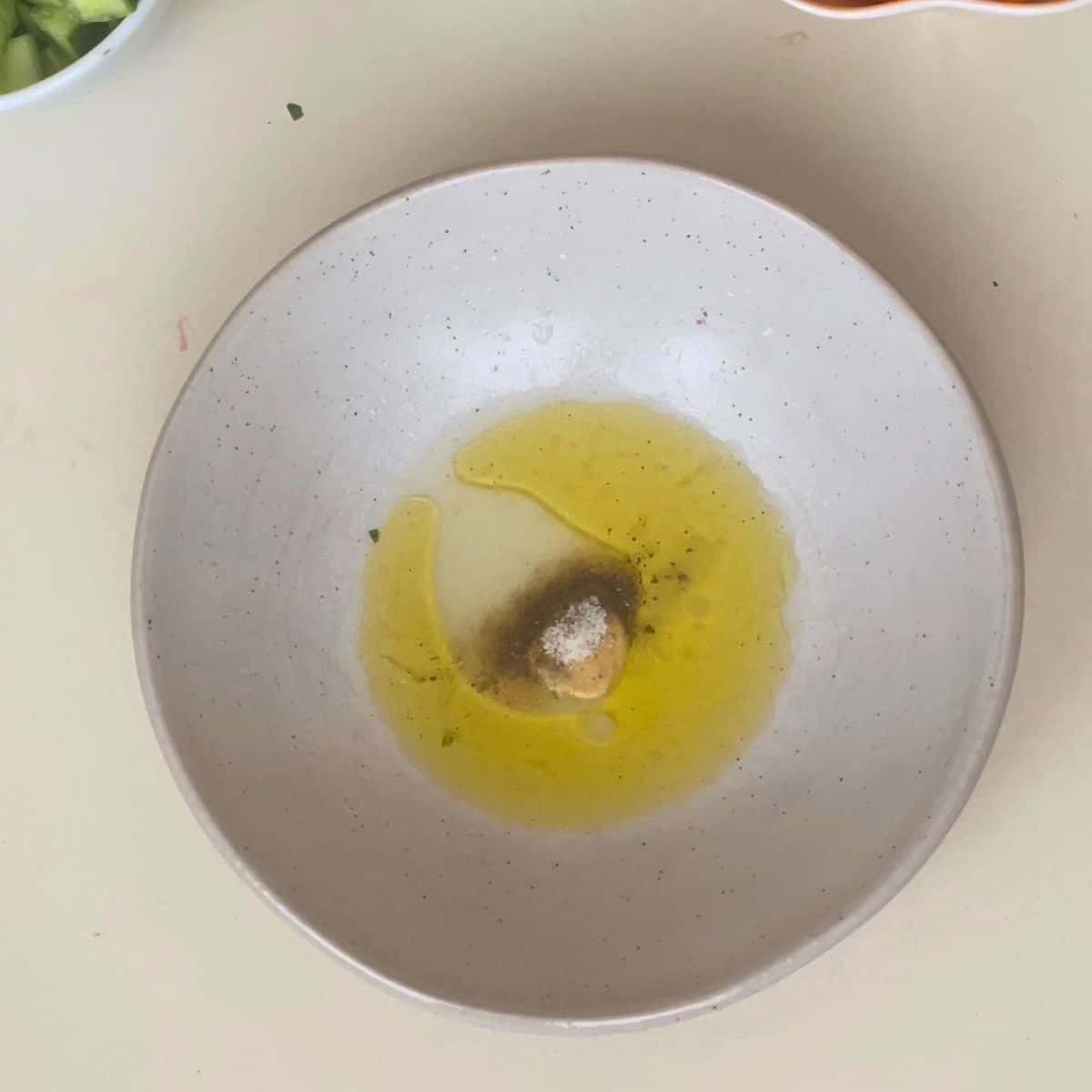 Lime vinaigrette in a salad bowl.