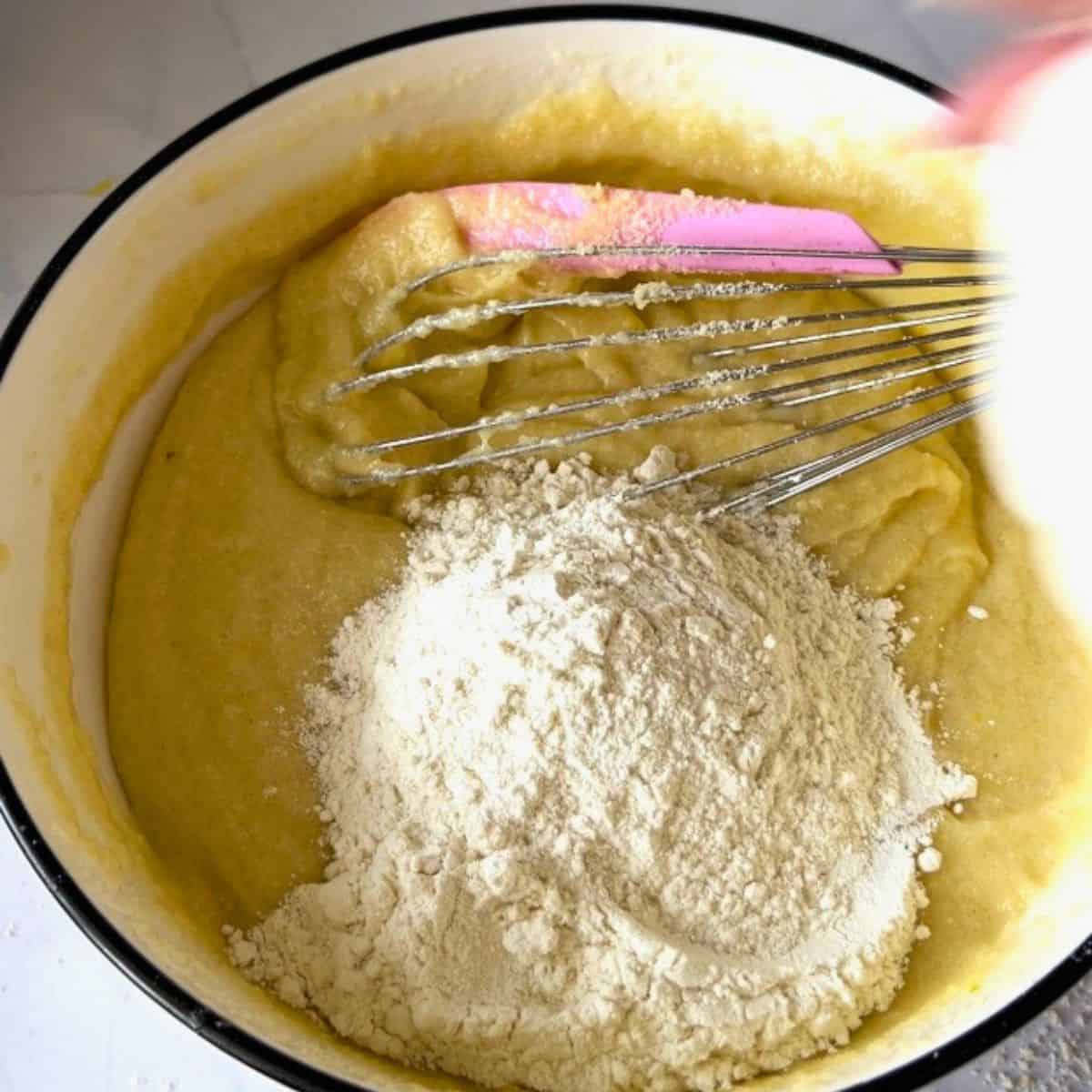Add all purpose flour to the almond cake.
