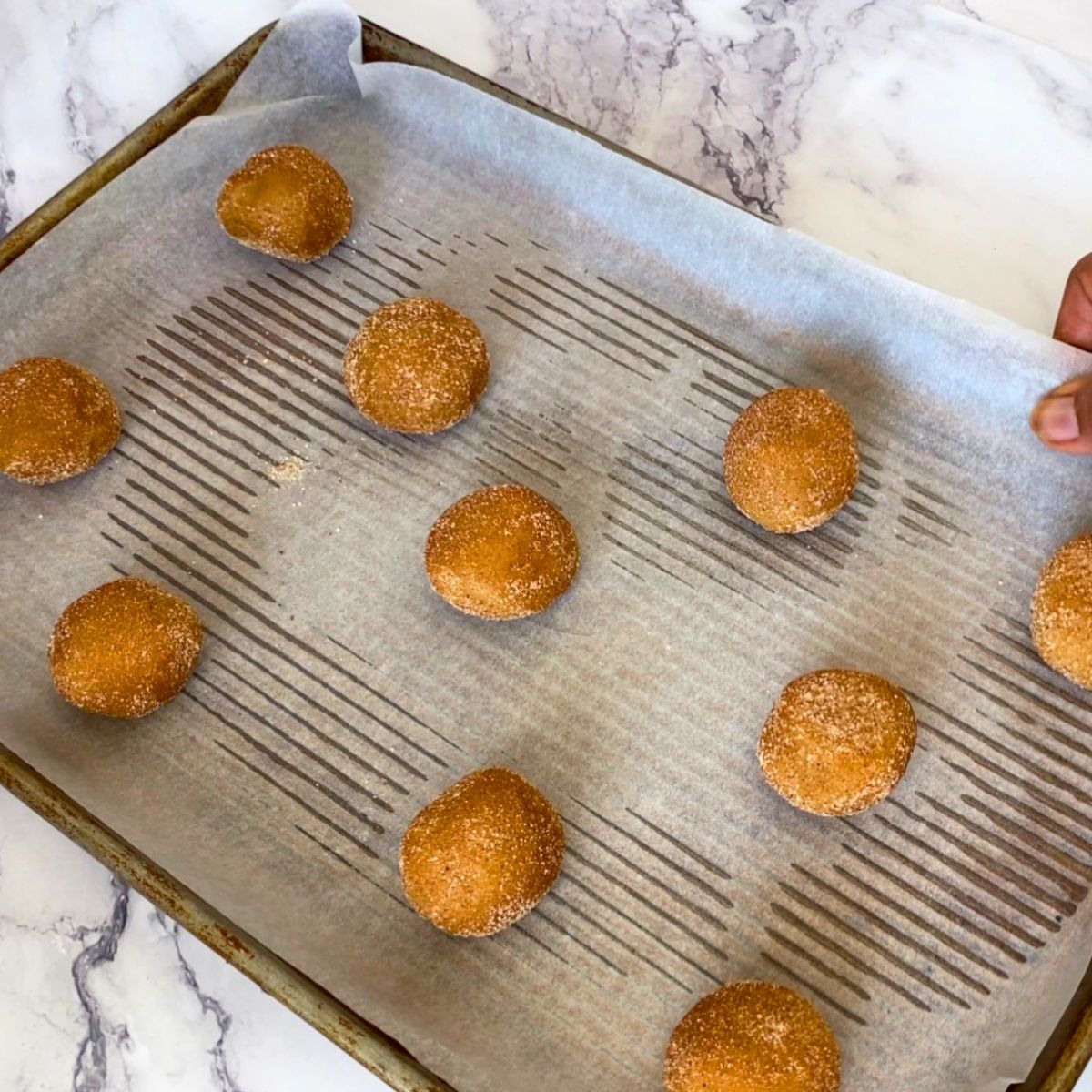 Cinnamon sugar cookies on a baking tray.