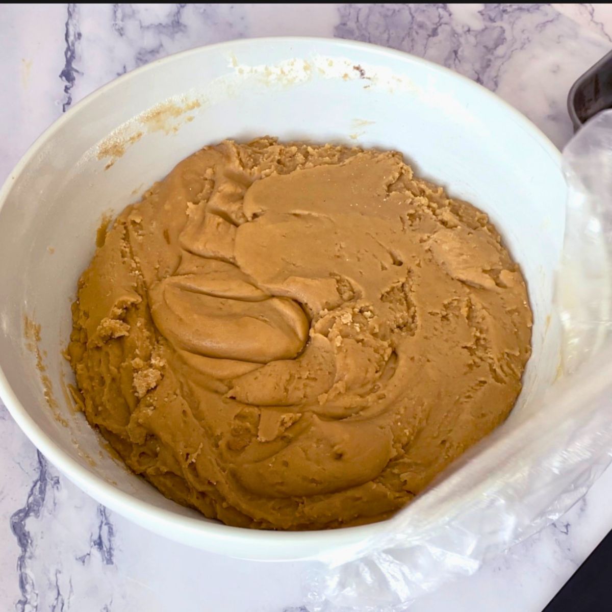 Chilled brown sugar cookie dough in a bowl.