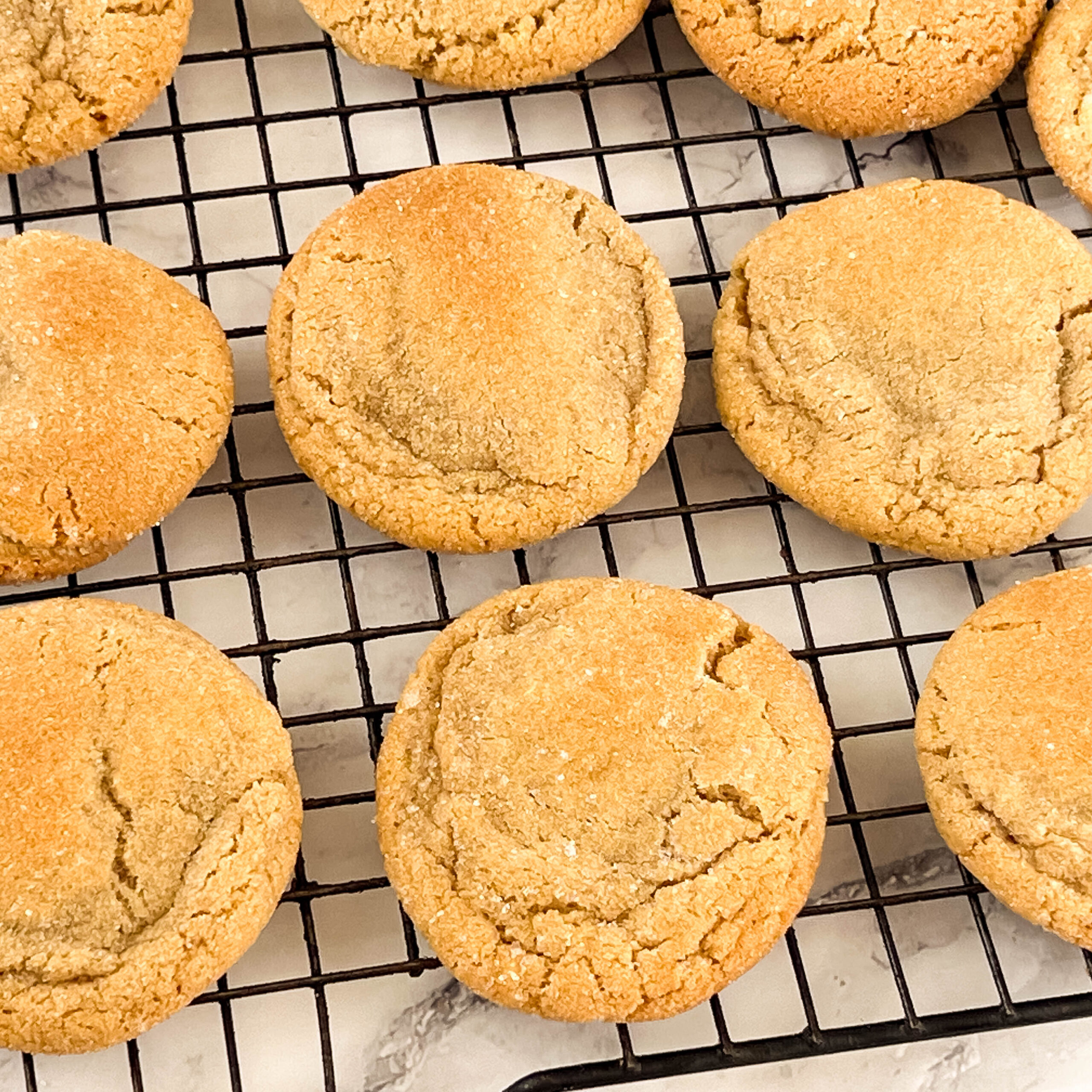A wire rack with fresh baked cookies.
