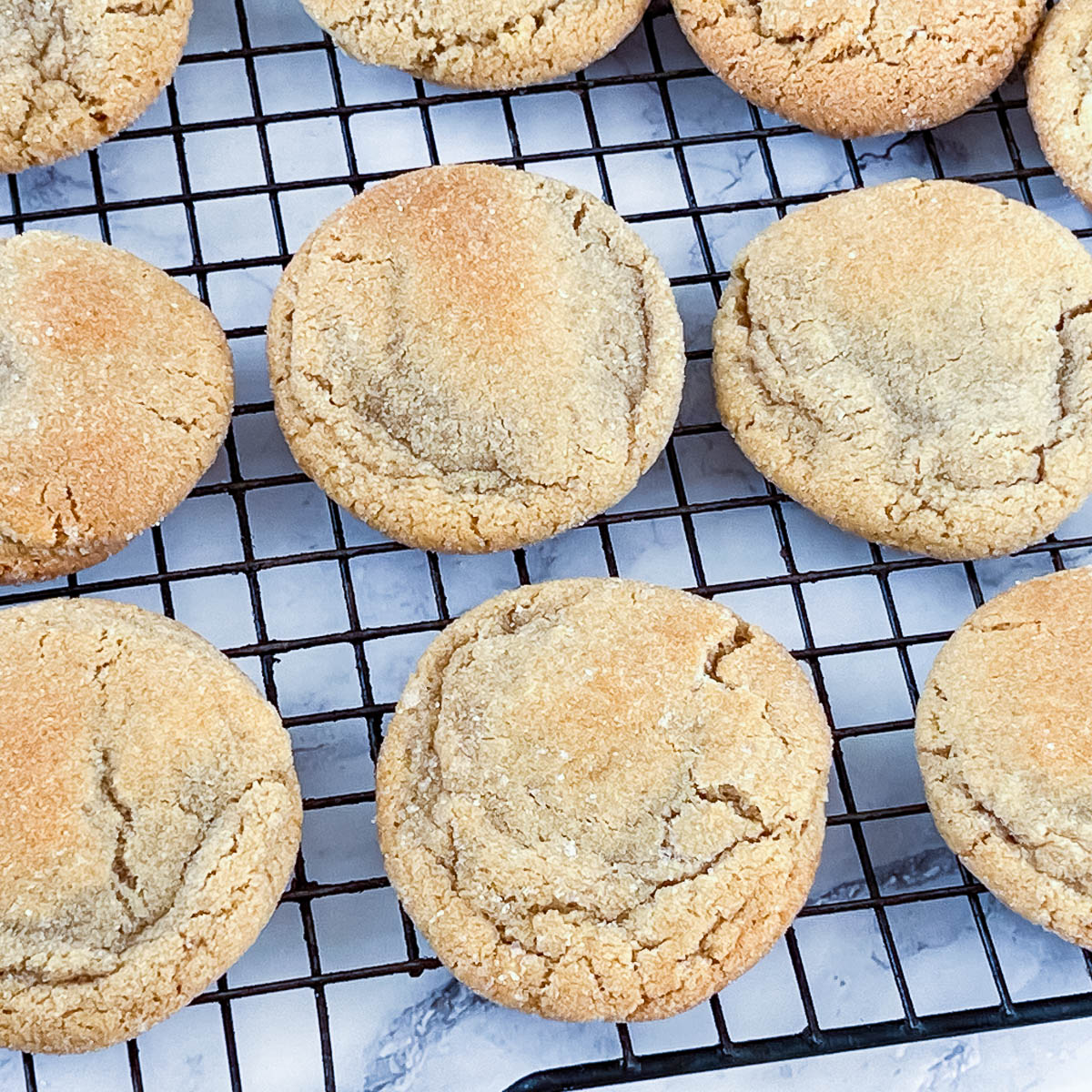 A wire rack with fresh baked cookies.