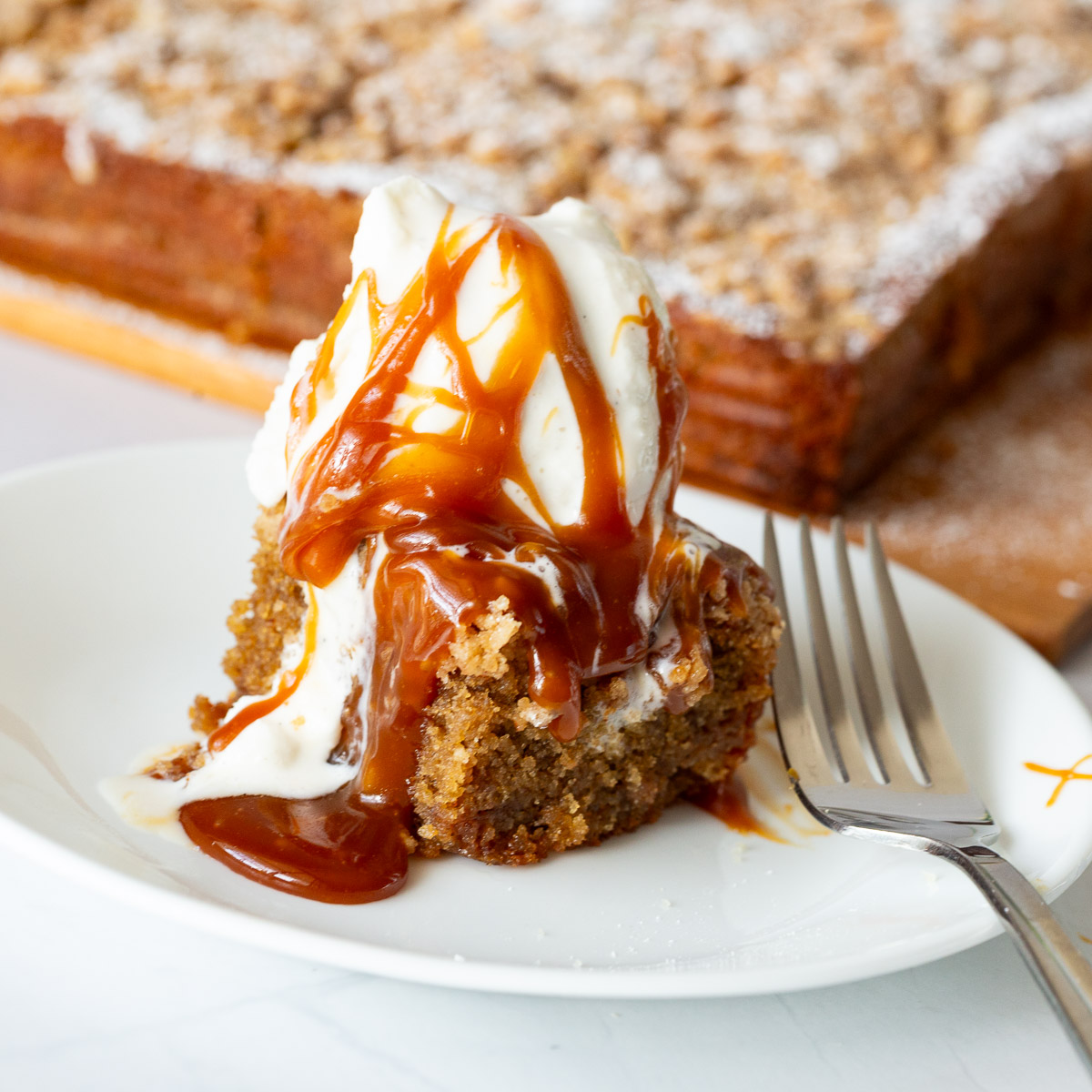 A slice of coffee cake with ice cream.