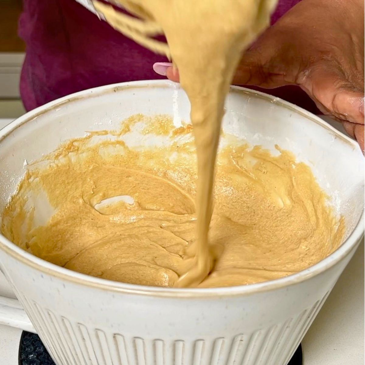 Coffee cake batter in a tall bowl.