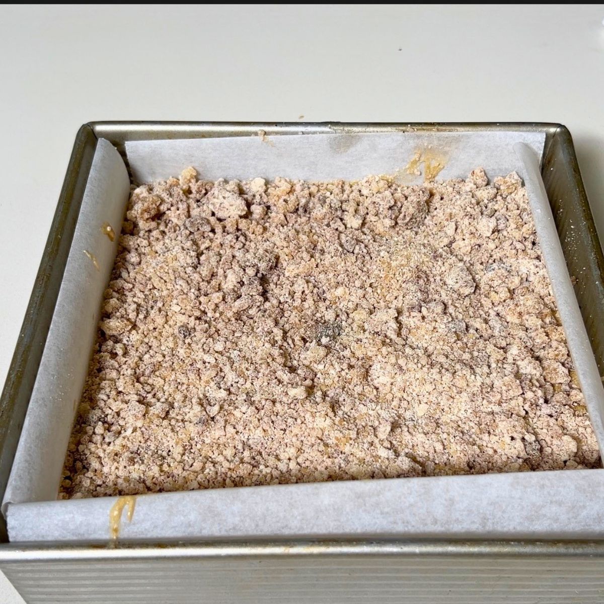 Adding streusel to the coffee batter.