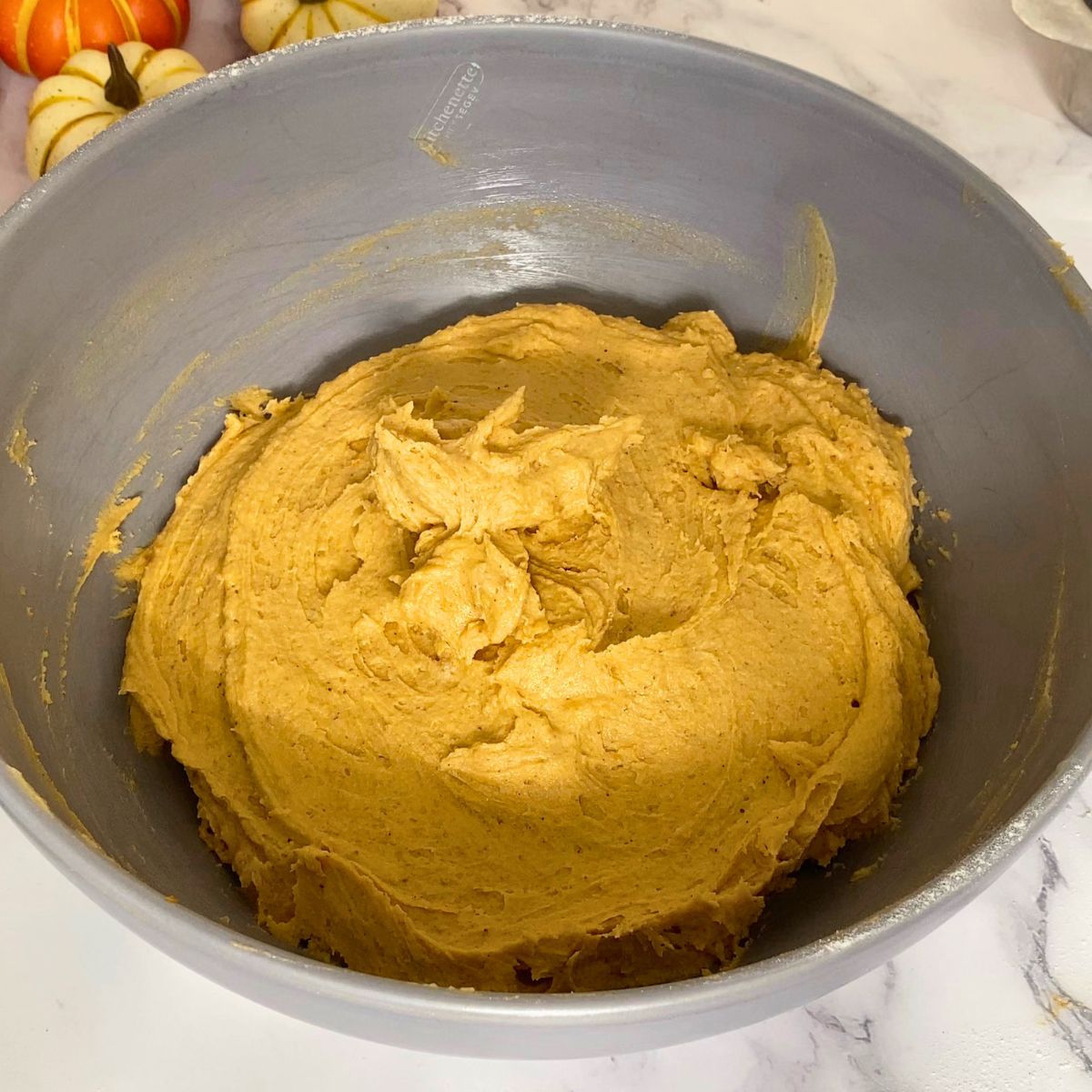 Pumpkin cookie dough in a bowl.