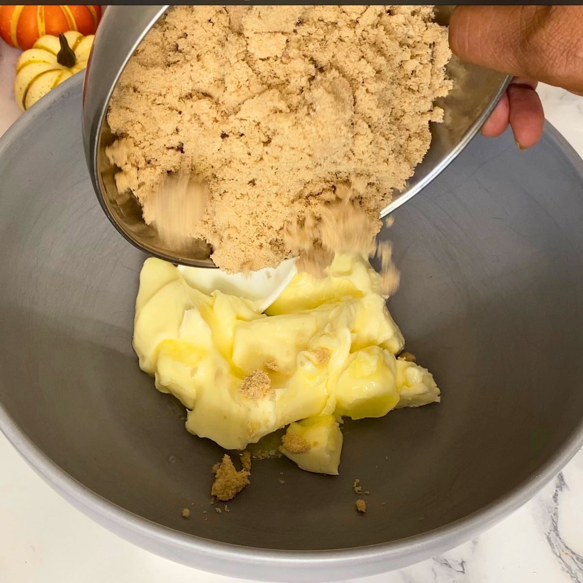 Cream butter and light brown sugar in a bowl.