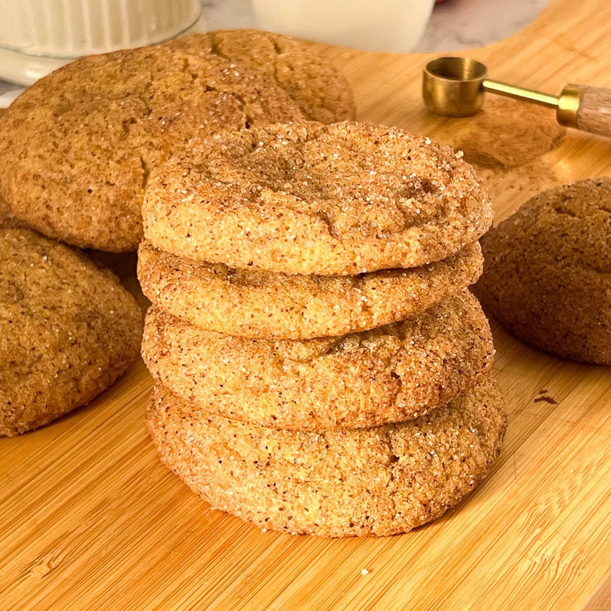 A stack of pumpkin cookies on the table.