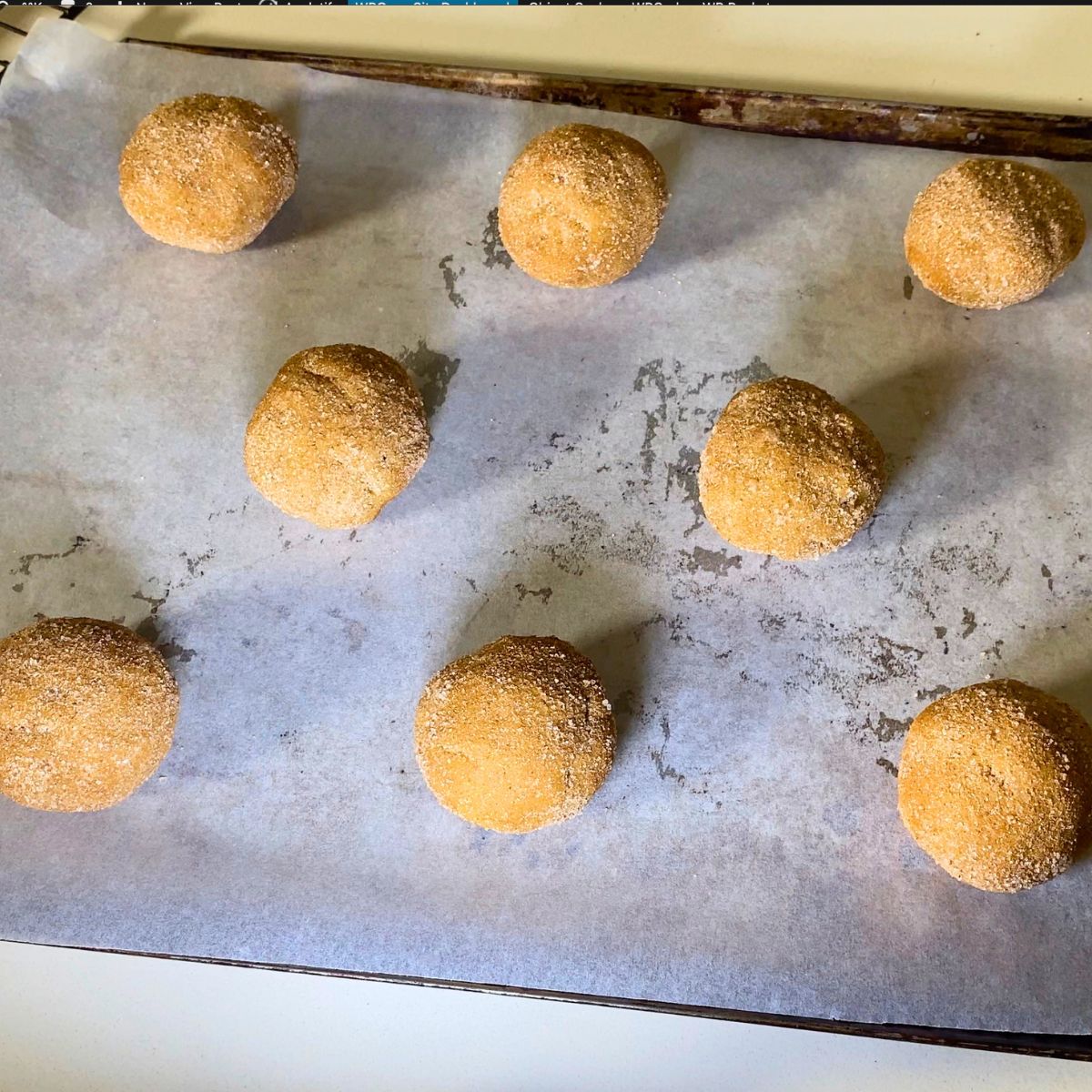 Baking tray with pumpkin cookies for baking.