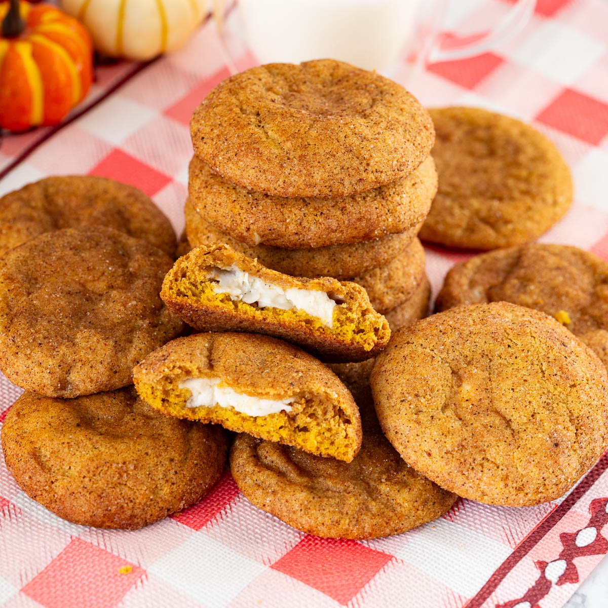 Cream cheese stuffed pumpkin cookies on the table.