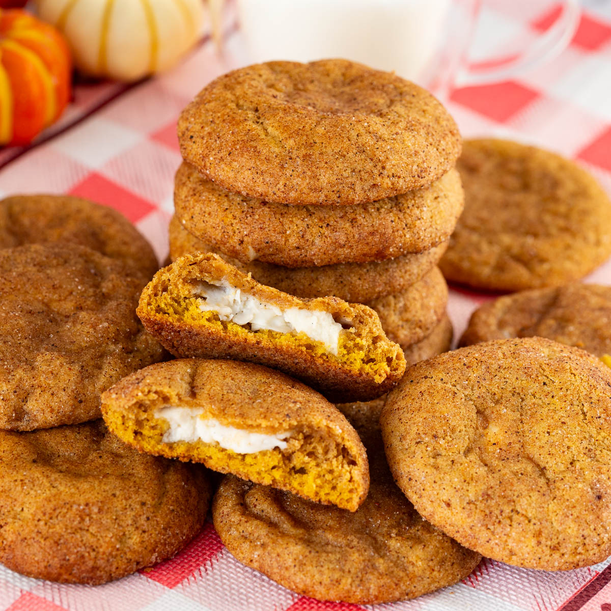 Cream cheese stuffed pumpkin cookies on the table.