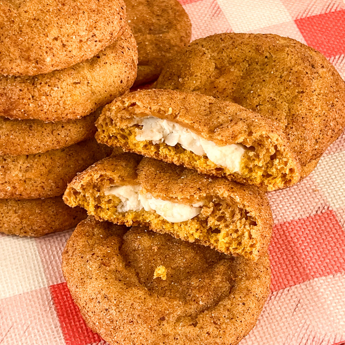 Pumpkin cookies stuffed with cream cheese.