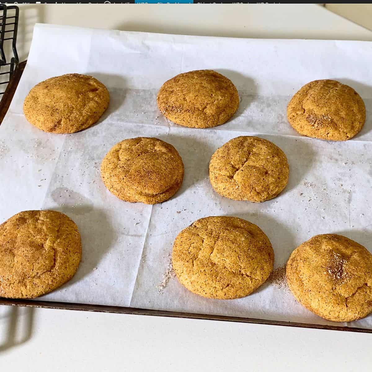 Baking tray with baked snickerdoodle cookies.