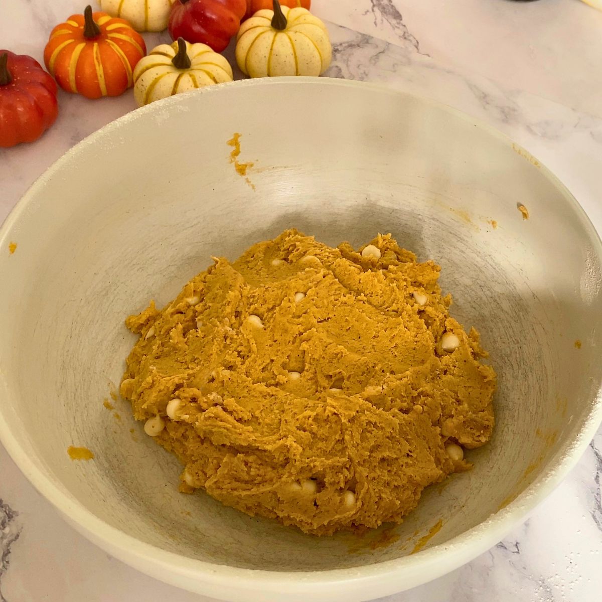 Chilling the pumpkin cookies with white chocolate chips.
