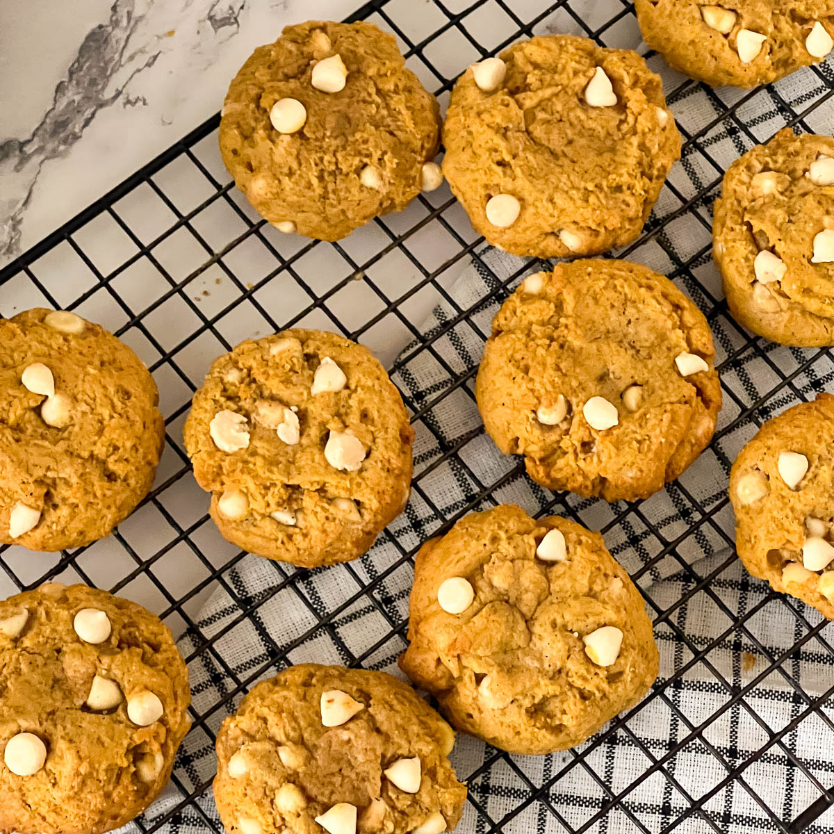 A wire rack with fresh baked cookies.