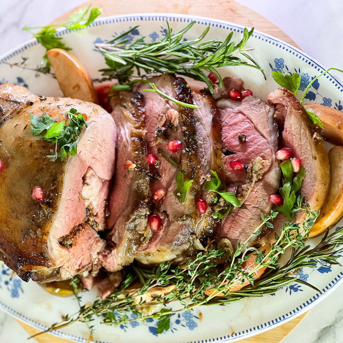Slices of lamb roast on a platter.