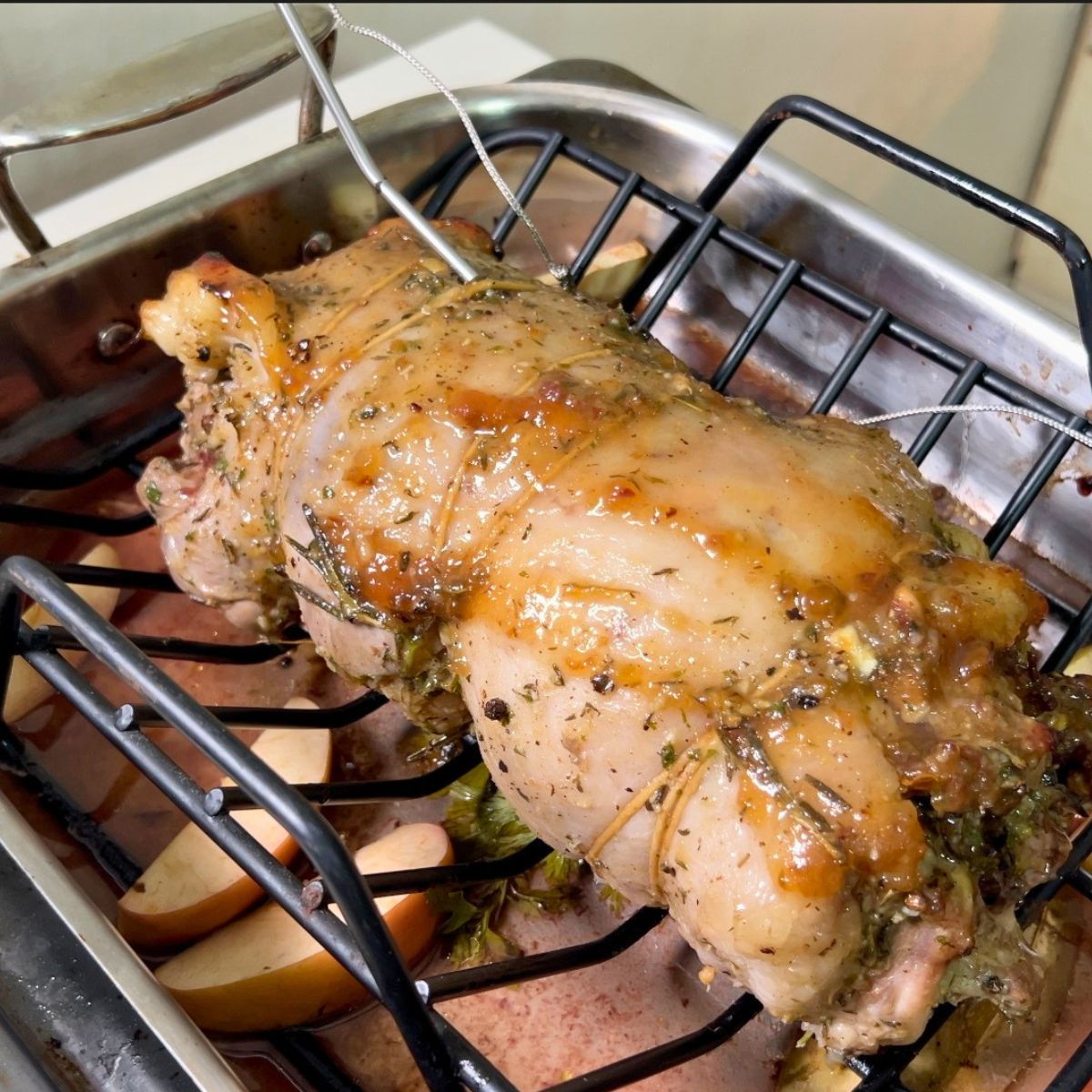 Poke a meat thermometer in to the lamb for roasting.