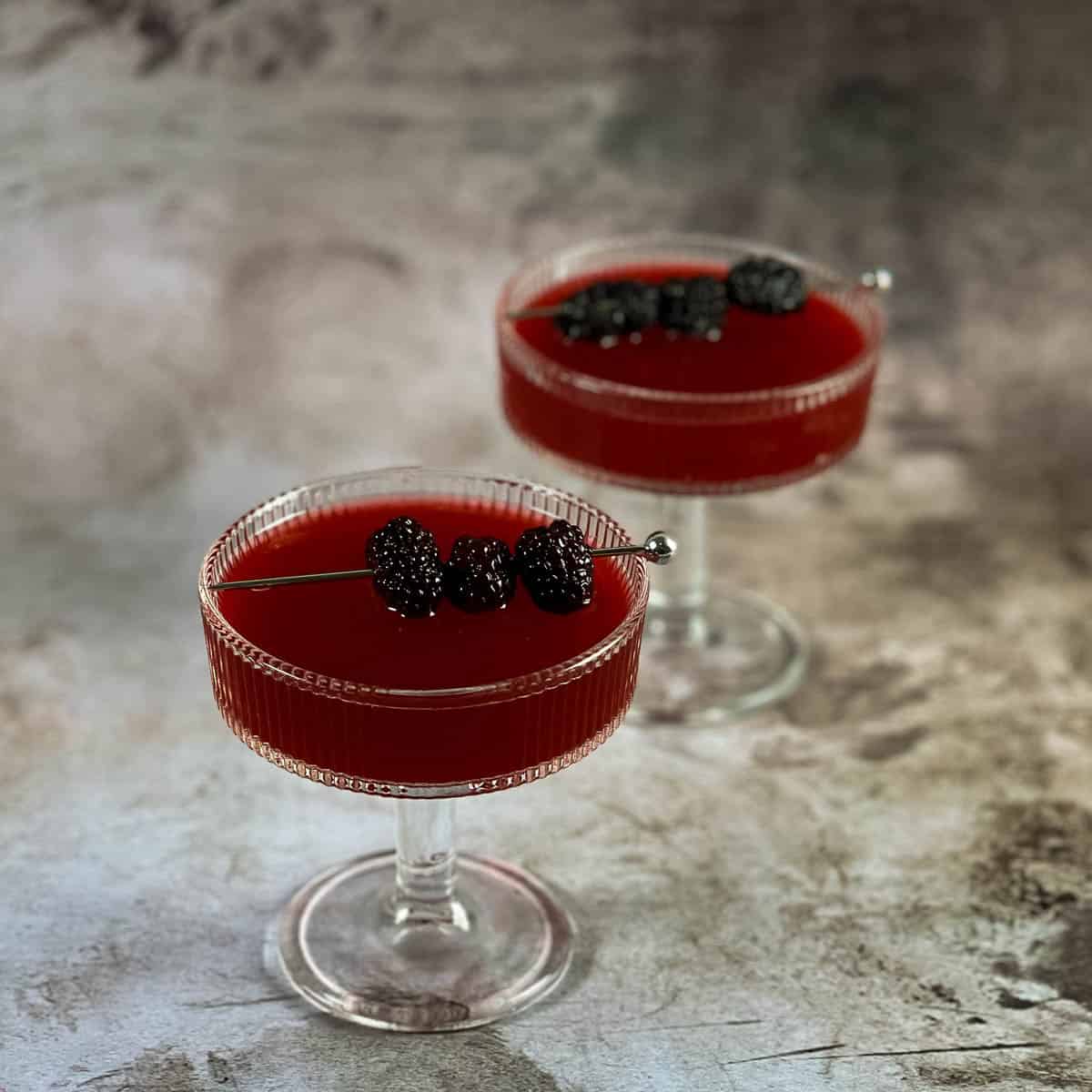 Two cocktail glasses on the table.