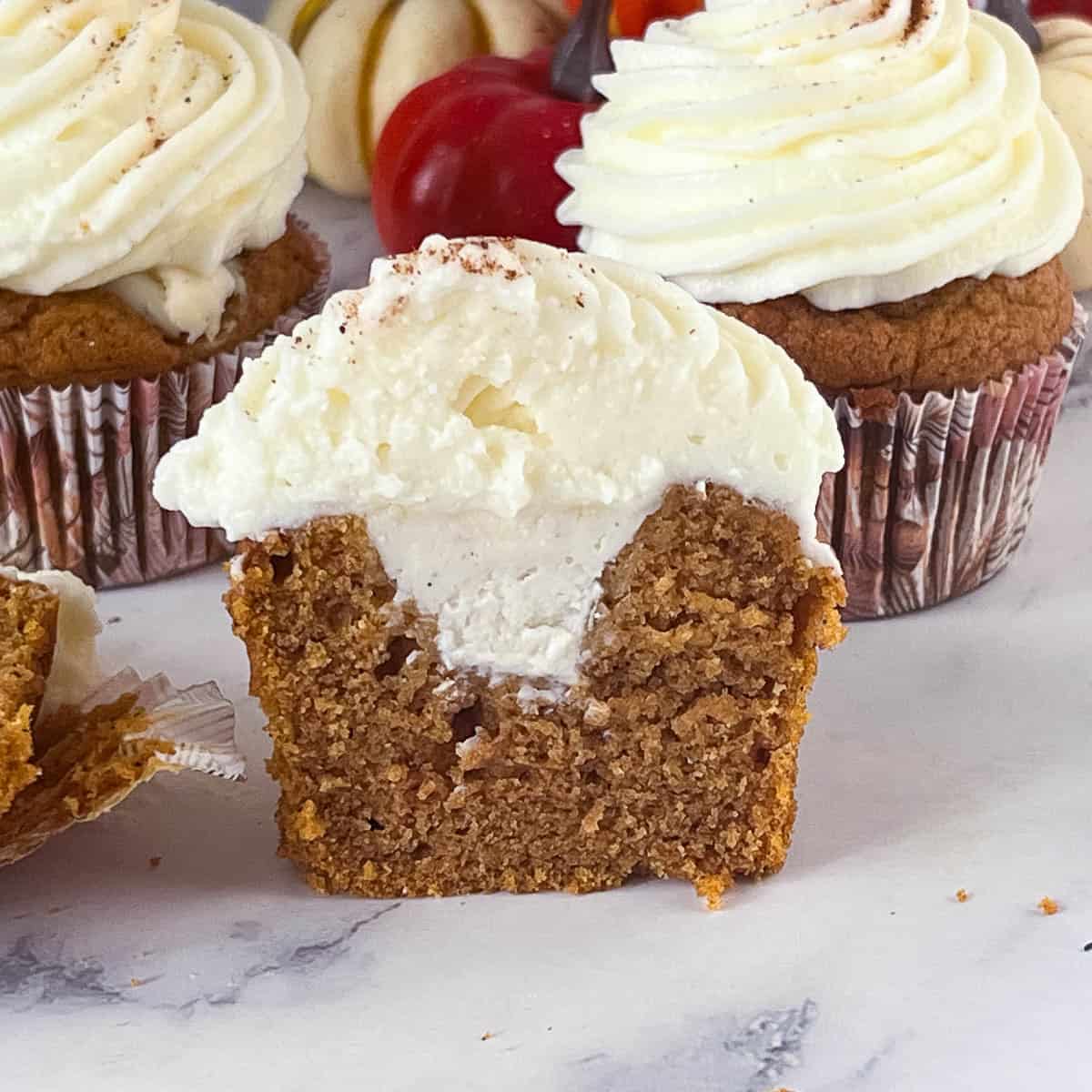 Cream cheese filling in pumpkin cupcakes.