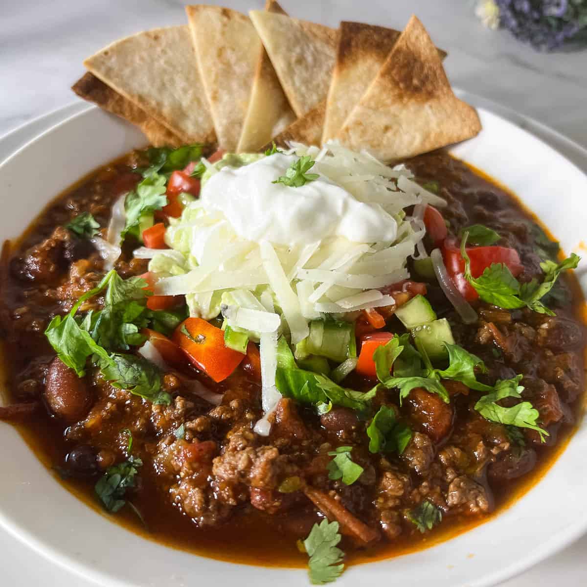 Soup with ground beef in a bowl.