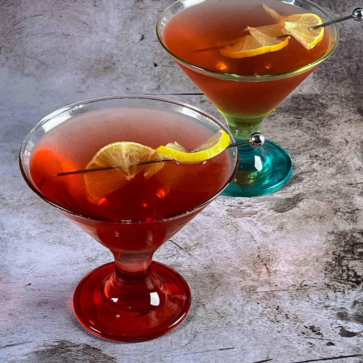 Two martini glasses with cocktails for halloween.