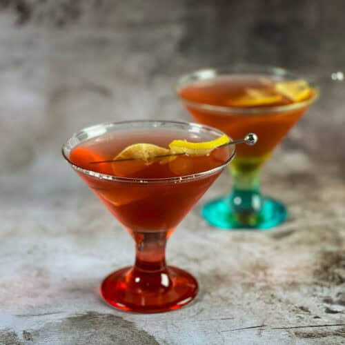 Halloween cocktails in two martini glasses.