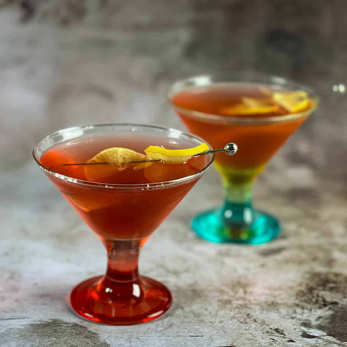 Two martini glasses with cocktails.